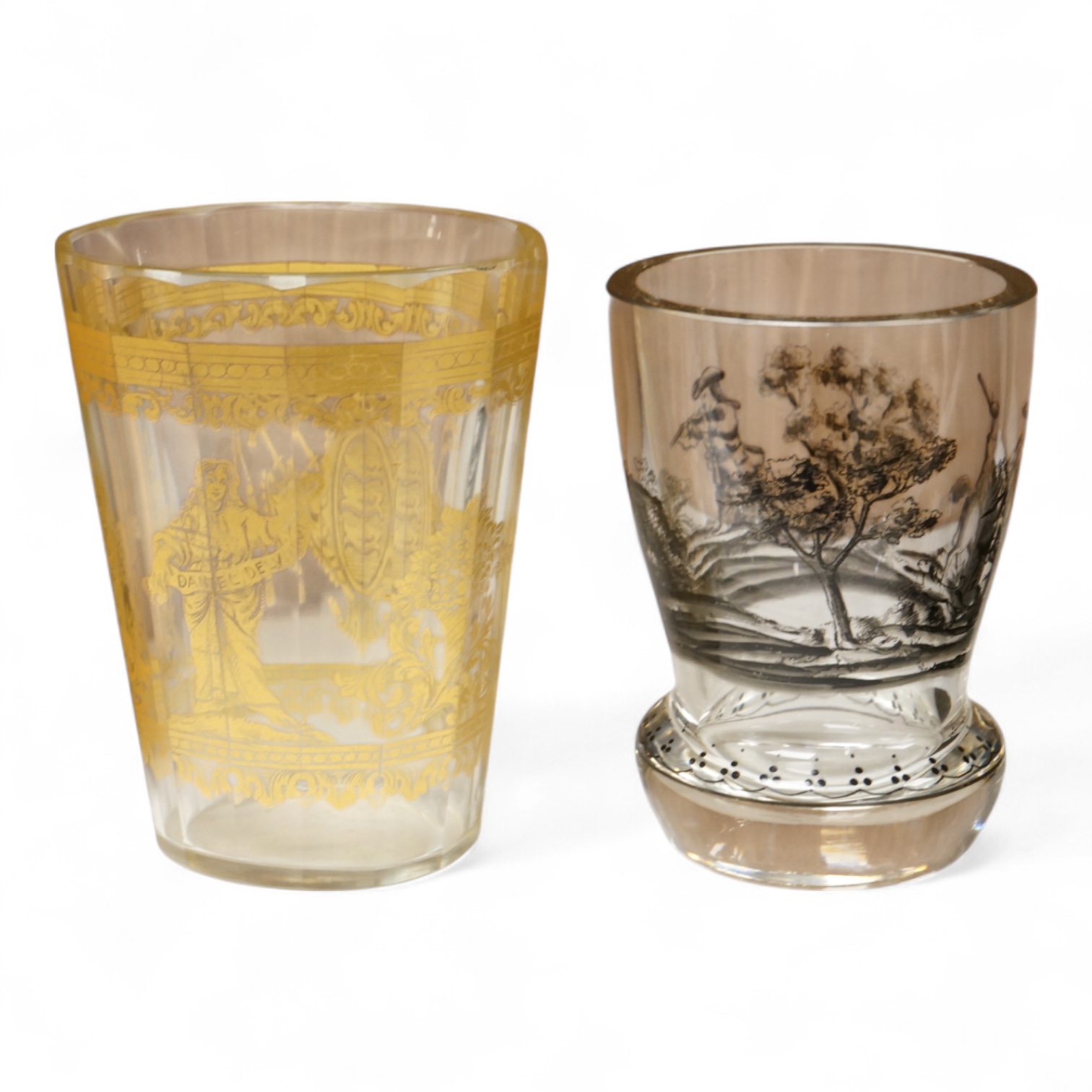 An Italian gilt-decorated and faceted beaker, inscribed Daniel Delvinis, the reverse with papal coat of arms, and a German Schwarzlot black enamelled ‘hunting’ beaker, largest 12cm (2)